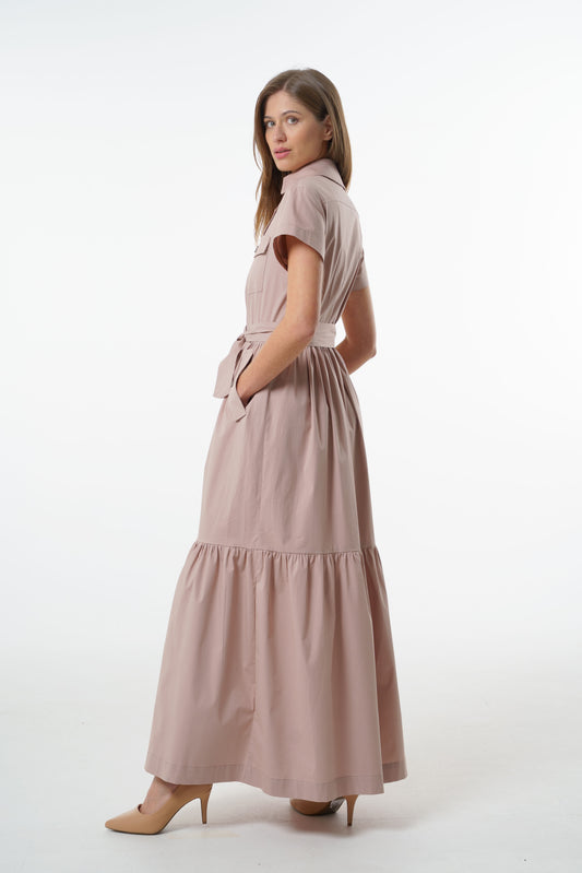 Dusty mauve cotton button‑down maxi dress with belted waist, short sleeves, and tiered skirt, angled front studio view on model.