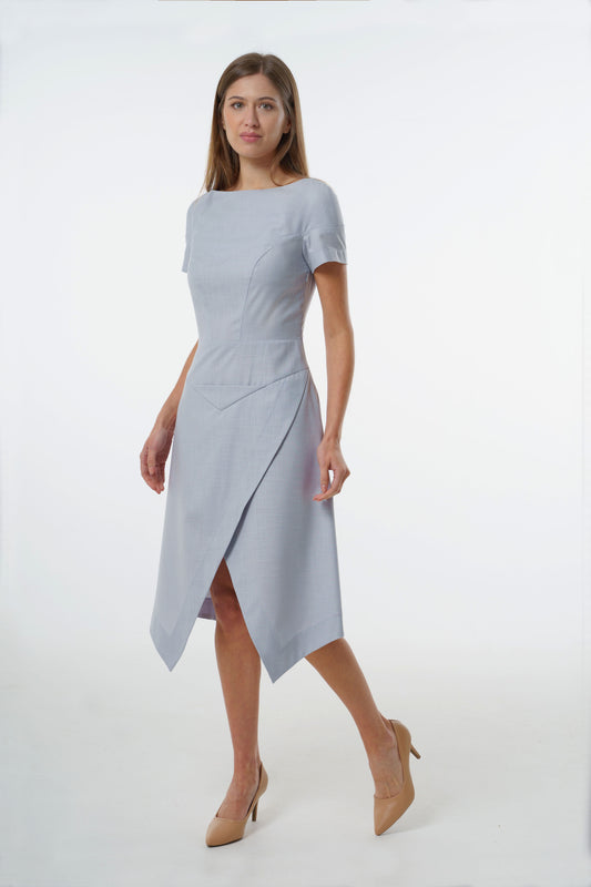 Pale blue tailored midi dress with asymmetric wrapped skirt and fitted short‑sleeve bodice, worn by a model, front studio view.