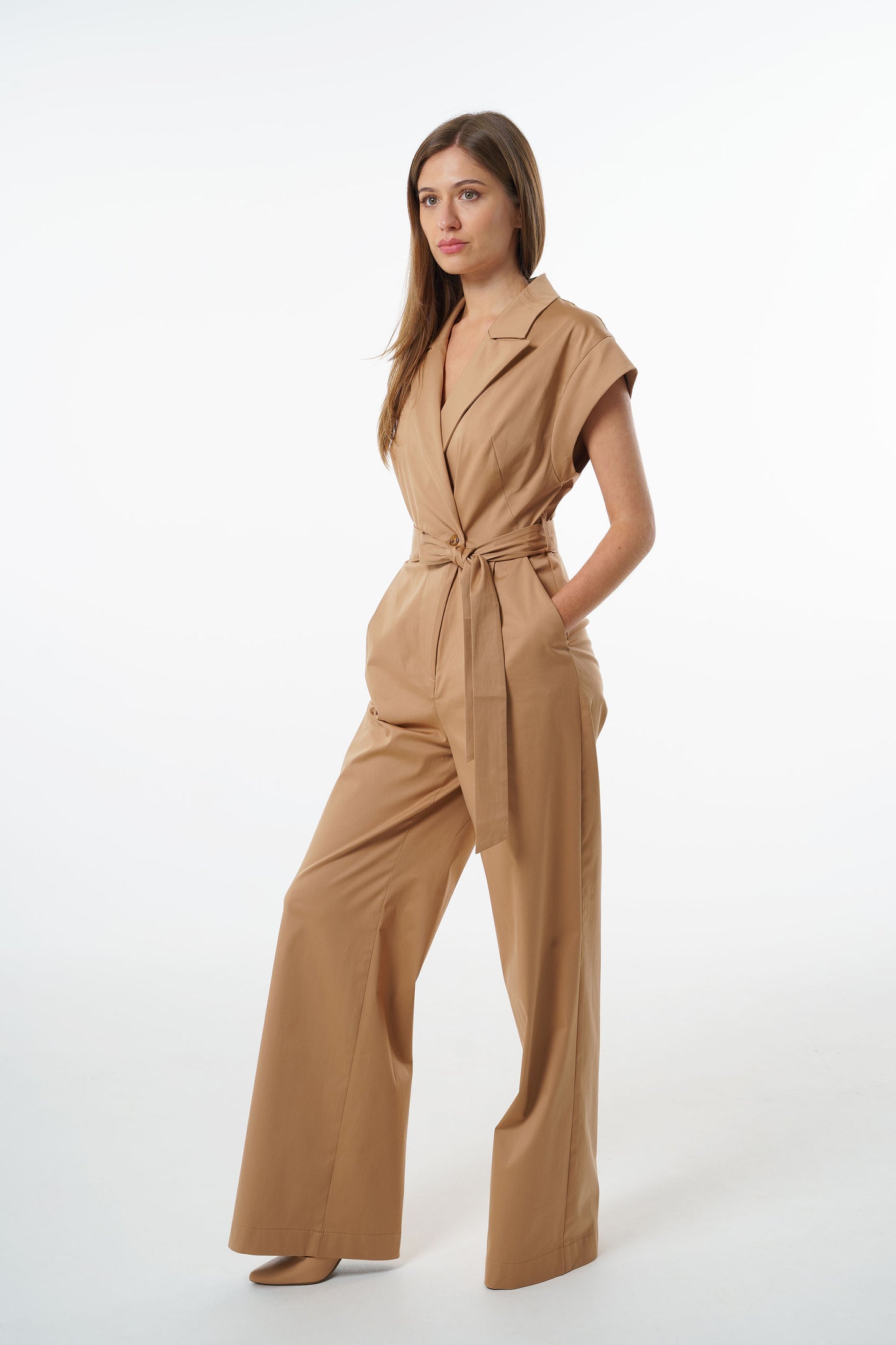 Camel wrap‑front wide‑leg jumpsuit in a cotton–viscose blend with short sleeves and a belted waist, worn by a model, full‑length front studio shot.