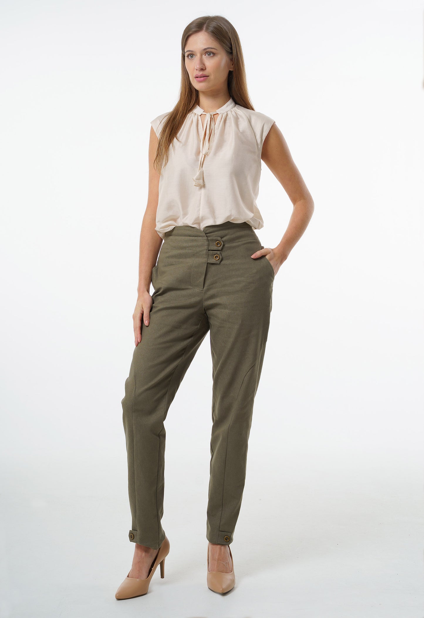 Olive high‑waisted stretch denim trousers with double‑button waistband and cuff button accents, worn by a model, front studio view.
