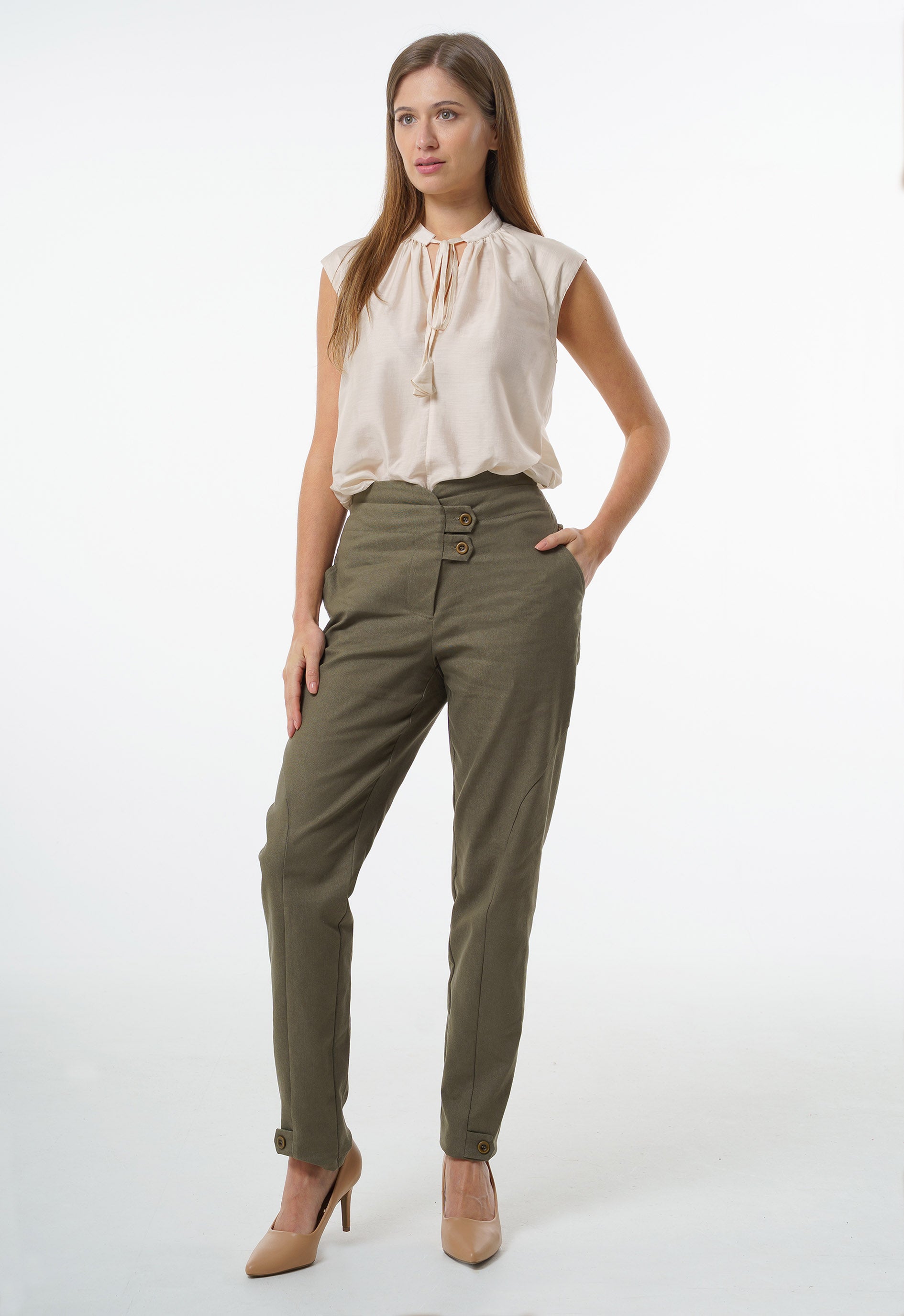Olive high‑waisted stretch denim trousers with double‑button waistband and cuff button accents, worn by a model, front studio view.