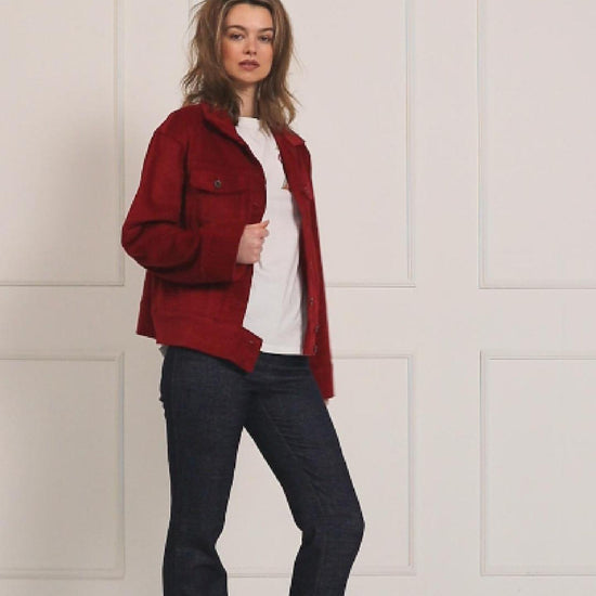 A studio video showcasing the fit and movement of the dark red corduroy jacket, highlighting the rich texture, buttons, and functional pockets.