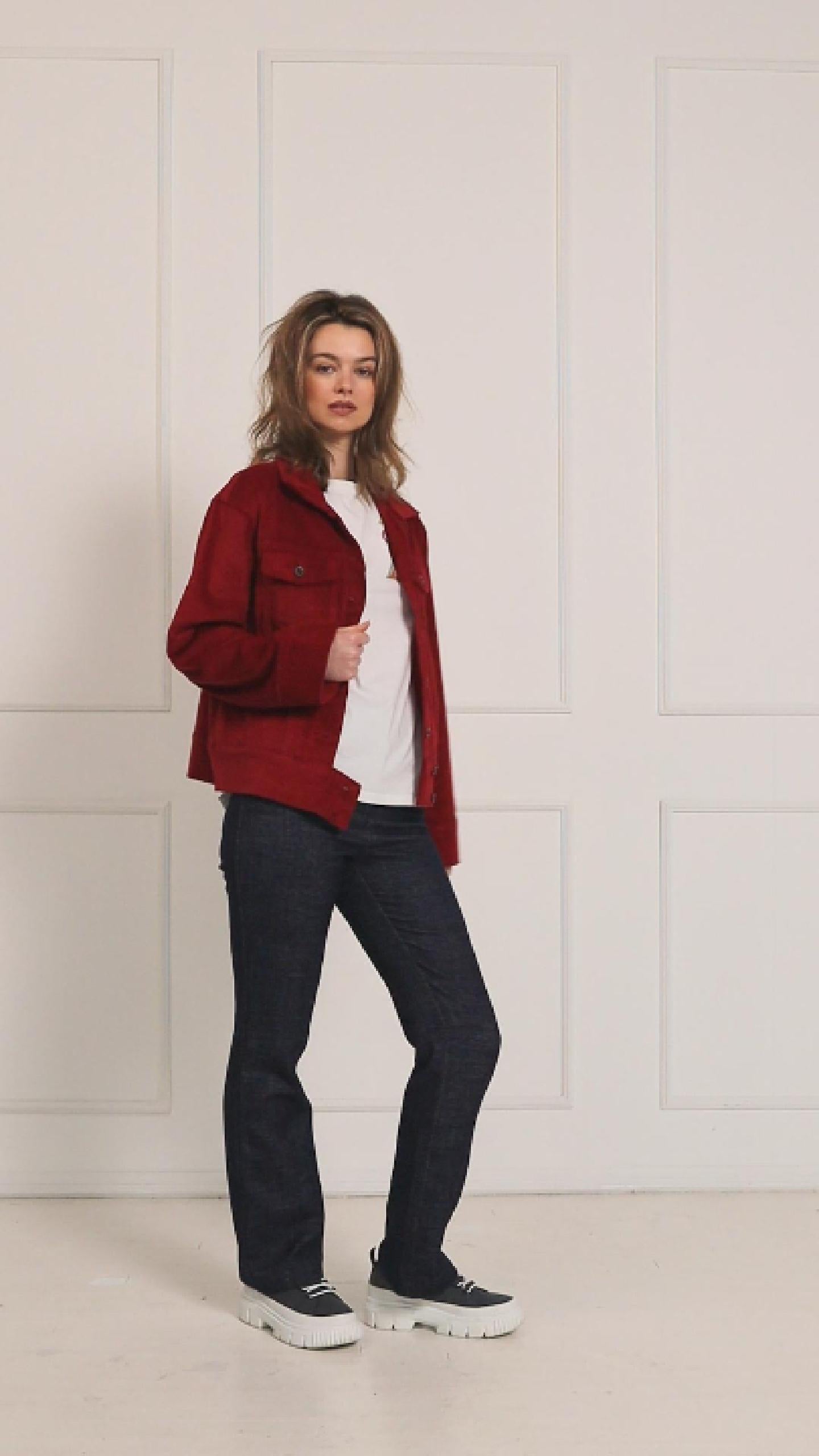 A studio video showcasing the fit and movement of the dark red corduroy jacket, highlighting the rich texture, buttons, and functional pockets.